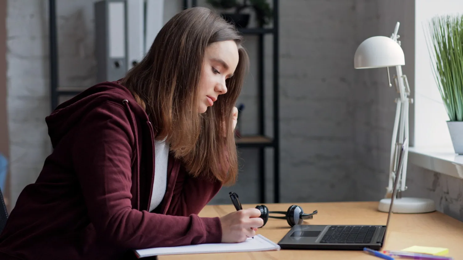 student planning a personal statement at a desk